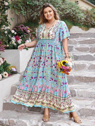 Plus Size Printed Tie Neck Flutter Sleeve Maxi Dress - Trendy by Luna