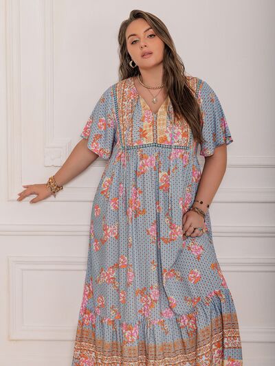 Plus Size Printed Tie Neck Flutter Sleeve Maxi Dress - Trendy by Luna